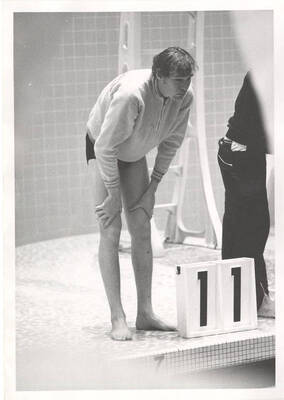 An unnamed Idaho men's swimmer eyes down the pool before a trial lap.
