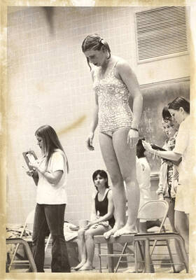 An unnamed Idaho women's swimmer assess her game plan before leaping off the starting block.