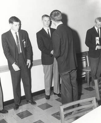 Attendees to the 37th National Convention of the Intercollegiate Knights, a national honorary service organization, network in a hallway.