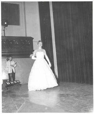 Queen contestant Sally Newland of University of Idaho walks across the Administration Auditorium during the 37th National Convention of the Intercollegiate Knights, a national honorary service organization.