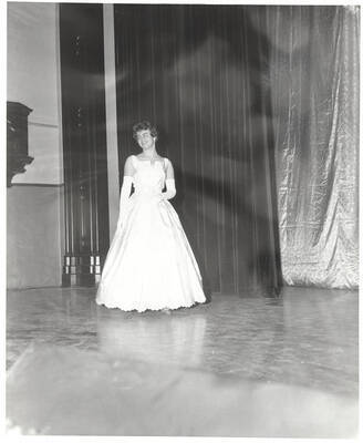 A contestant for queen walks across the Administration Auditorium during the 37th National Convention of the Intercollegiate Knights, a national honorary service organization.