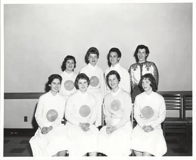 A group photo of the new members of the Spurs, a national honorary service organization, with their faculty advisor. Individuals identified from left to right. Front: Diane Heller, Rowena Eikum, Bette Vickerman, Cooki Goodman; back: Angie Arrien, Mary Elise Winegar, Judy Libby