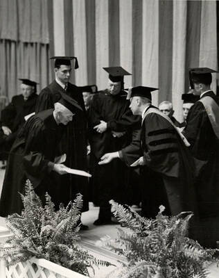 John Warren Brigham, a Legislator from Genesee who introduced a bill founding the University of Idaho, receiving an honorary degree during the 1939 Commencement ceremony.