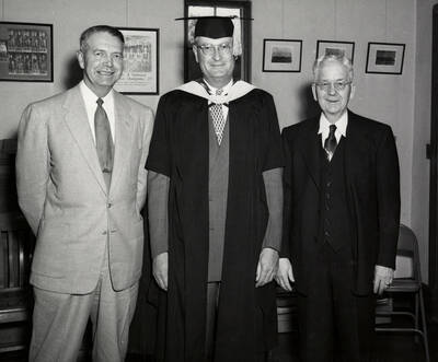 Governor Len Jordan stands with University of Idaho President Jesse Buchanan and James E. Graham for the 1953 Commencement ceremony.