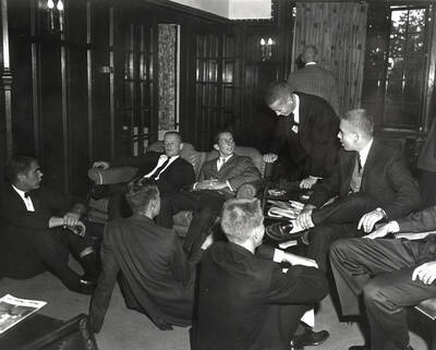 Current and potential members of Beta Theta Phi sit and talk during rush week.