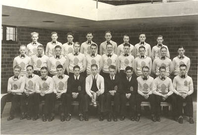 Members of the Intercollegiate Knights, a national honorary service organization, pose for a group photograph in the Memorial Gymnasium.
