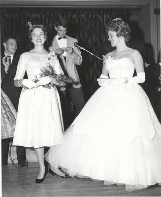 Contestants for queen applaud as the winner is selected during the 37th National Convention of the Intercollegiate Knights, a national honorary service organization.