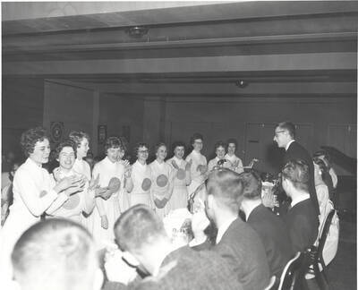 Spurs sing 'Happy Birthday' to Godron Chester, the head national officer and chairman, at the 37th National Convention of the Intercollegiate Knights, a national honorary service organization.
