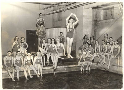 Members of the Helldivers swimming club by congregate and joke near the pool.