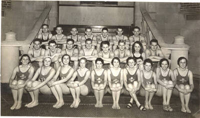 Members of the Helldivers swimming club pose for a group photograph on the stairs inside Memorial Gymnasium.
