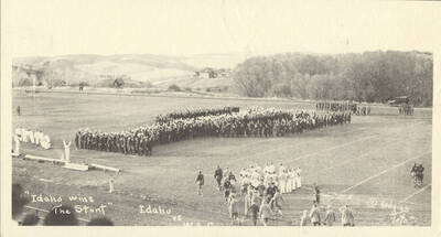 Idaho students participate in the Idaho Stunt for the Harvard Yell Contest. Caption reads: Idaho Wins the Stunt, Idaho vs W.S.C., #7.