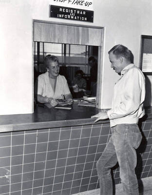Hazel M. Erickson helps a student register for classes during University of Idaho's registration week.