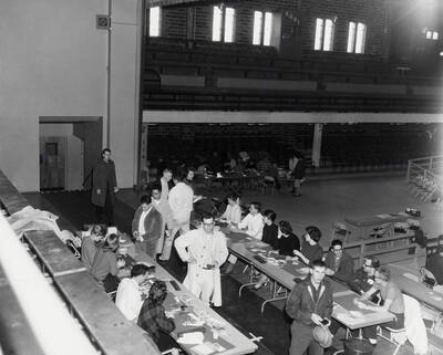 Students pass through the registrars tables after completing registration.