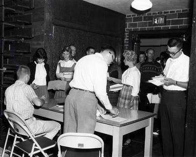 Students stand in line in the entranceway of the Memorial Gymnasium to begin registration.