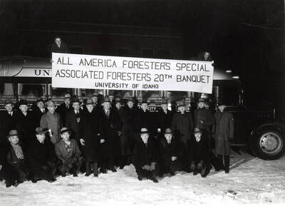 Group picture of the Associated Foresters taken outside, in front of a bus before the  All America Foresters Special Associated Forester's 20th Banquet.