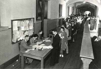 Students verify enrollment and paperwork before registering for classes in the Administration building.