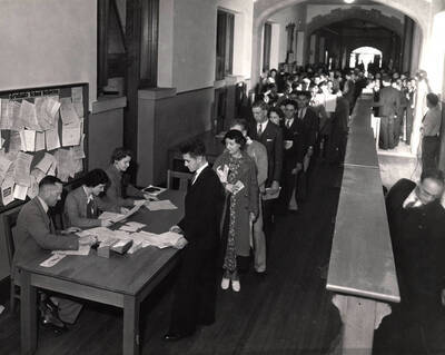 Students verify enrollment and paperwork before registering for classes in the Administration building.