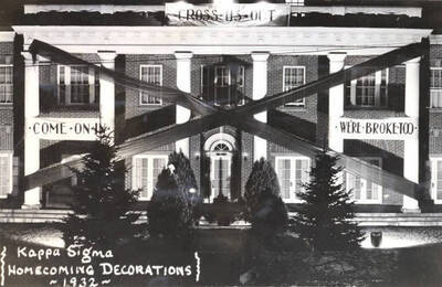 Kappa Sigma's Homecoming decorations featured signs reading, 'Come on In', 'We're Broke Too', with a black fabric X across the front of the house.