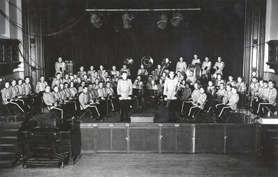 The University of Idaho Military Band poses for a photograph in convert formation in the Administration Auditorium.