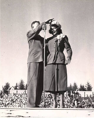 William Guernsey, Alumni Association President crowns Shirlie Vorous Homecoming Queen.