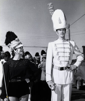 Majorette Bonese Collins and Drum Major Stanley Blackwell stand next to each other before the Homecoming football game.