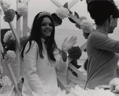 Glennis Conner, Homecoming Queen, sits on a float with other Homecoming royalty during the Homecoming parade.