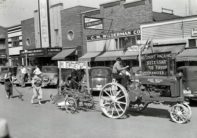 Agricultural engineering students display the evolution of farming equipment during Idaho's Little International Agriculture Show parade.