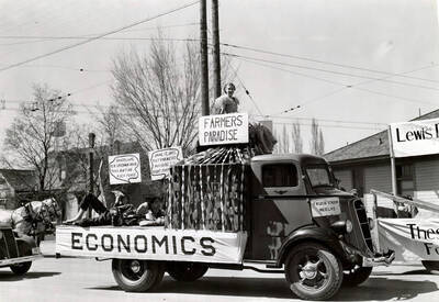A sign reads 'farmer's paradise' on a truck labeled 'economics' during Idaho's Little International Agriculture Show.