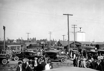 Crowds of people swarm around the Moscow station of the American Railway Express.