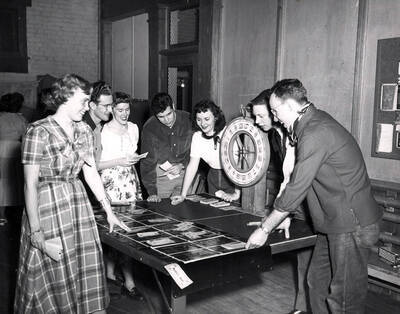 Students playing a game of wheel of fortune during the annual Muckers' Ball.