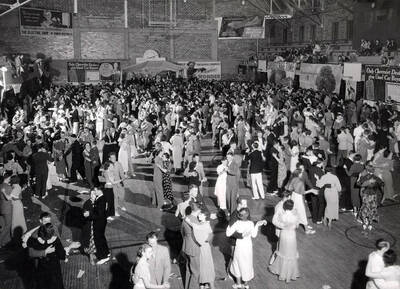 An overhead shot of students dancing in the Memorial Gym for the Publications' Ball.