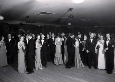 Students stop dancing to talk and look at the camera during Idaho's annual Senior Ball.