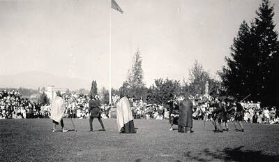 Actors perform in a pageant on the Administration Lawn in front of a crowd of spectators for Idaho's Campus Day celebrations.