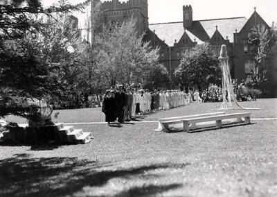 Faculty and students dressed in formal wear walk in the procession line during Idaho's Campus Day celebrations.