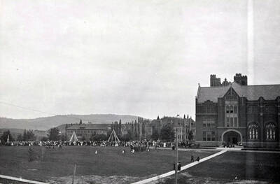 A far-shot of the maypole dance performance by students and the children of Moscow on the north side of the Administration Building during Idaho's Campus Day celebrations.