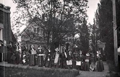 School children dressed in black robes, representing the library for Idaho's Campus Day parade.