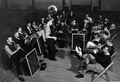Band director William Ames leads the pep band during a rehearsal.