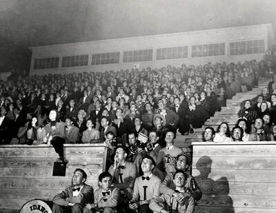 The Idaho pep band sits with an attentive crowd at Neale Stadium, all watching the festivities in awe.