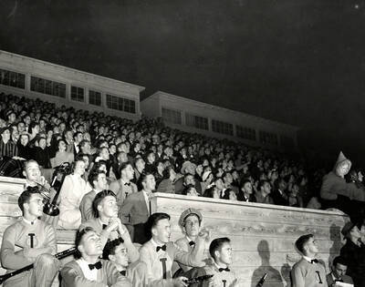 Another angle of the Idaho pep band sitting below the audience, watching the football game.