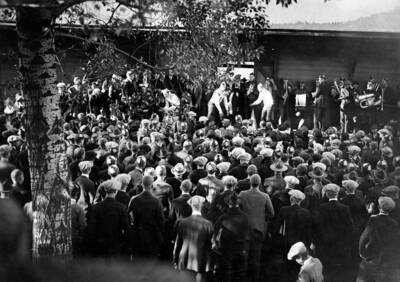 The Idaho pep band lines up in front of flocks of students for a performance at the train depot east of campus.