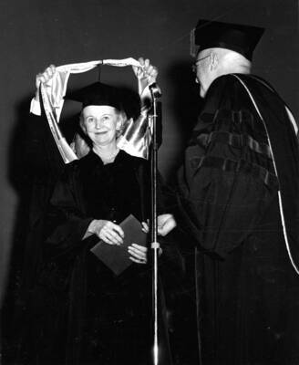 Newspaper columnist Inez Callaway Robb is hooded and receives an honorary doctorate degree in literature.