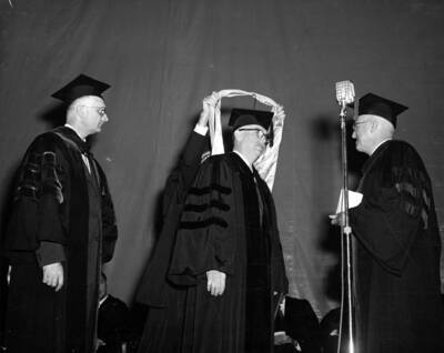 Thomas C. Galloway is hooded and receives an honorary doctorate in science.