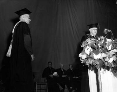 President Donald R. Theophilus speaks regarding the retirement of Claude W. Ashby at University of Idaho's commencement.