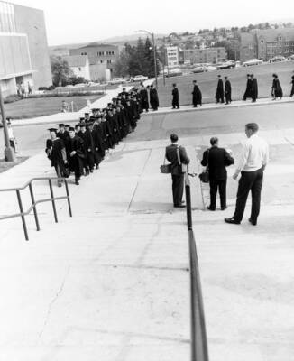 Heads of colleges lead the commencement procession into Memorial Gymnasium for Idaho's commencement.