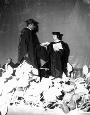 University of Idaho running back and future NFL player Ray McDonald receives his diploma during Idaho's commencement.