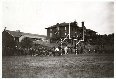 A dogpile in the endzone at a football game between the University of Idaho and Washington State College.