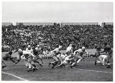 A large crowd watches as Idaho takes on North Dakota during a football game that ended with a score of 27-0.
