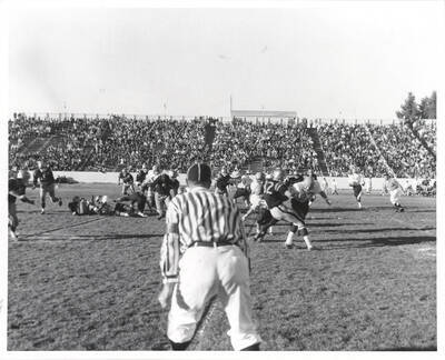 An Idaho receiver fights off two Spartan tacklers for extra yardage.