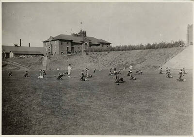 Idaho football players stretch out prior to a game.