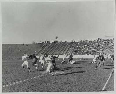 Washington State's running back gets behind Idaho's defense and looks for a reception for a big gain.